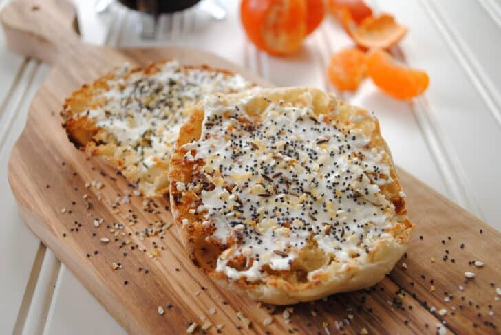 An english muffin with cream cheese and everything bagel seasoning.