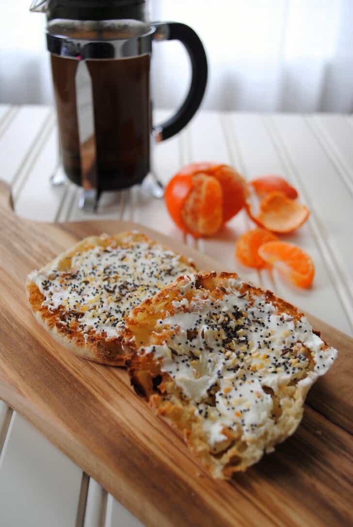 Cream cheese on an english muffin with everything bagel seasoning.