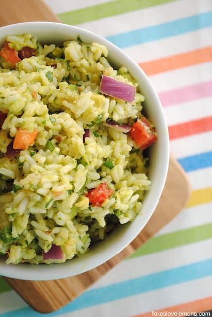 Guacamole Rice - all of the ingredients from guacamole, smashed into rice for a unique side dish! Serve warm or cold. | foxeslovelemons.com