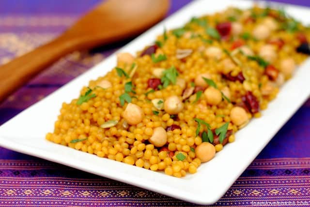 Curried Cranberry Couscous Pilaf – an easy yet elegant side dish of Israeli couscous tossed with chickpeas, dried fruit and nuts. | foxeslovelemons.com