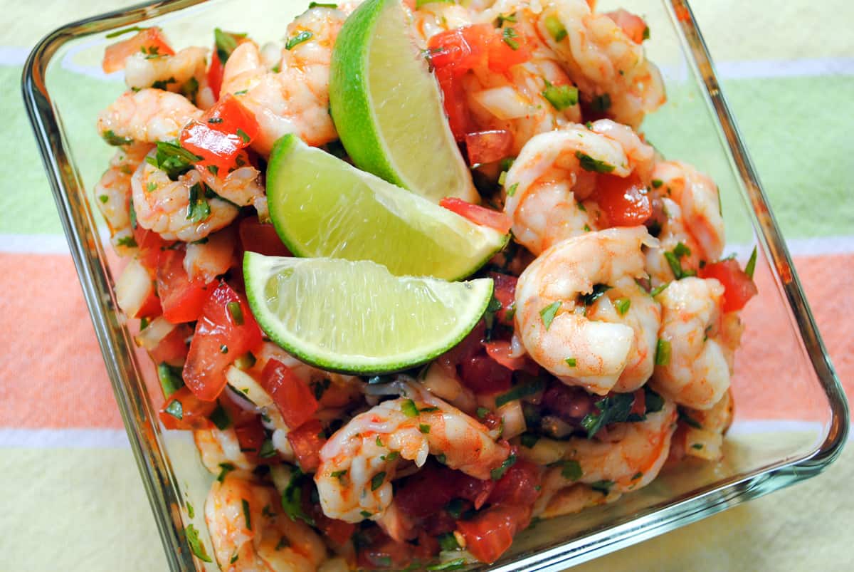 Fresh, healthy and easy! This Shrimp Ceviche recipe will wow as a restaurant-quality party appetizer that is so simple to make at home. | foxeslovelemons.com