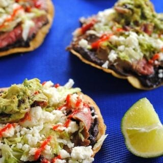 Flank Steak Tostadas – a quick and easy weeknight meal featuring grilled flank steak, black beans and queso fresco. | foxeslovelemons.com