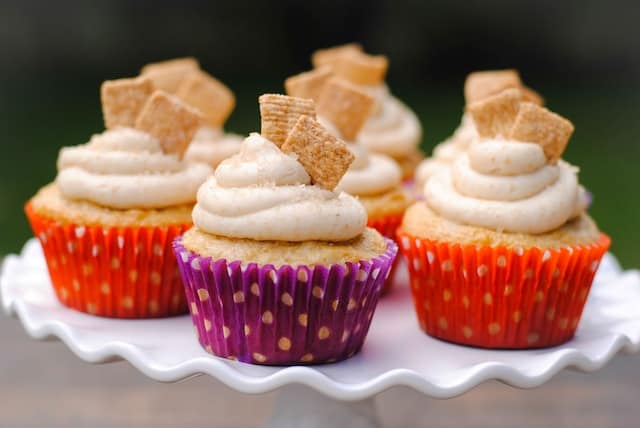 Cinnamon Toast Crunch Cupcakes - a festive cupcake that tastes just like the kid's cereal. Recipe originally published by Your Cup of Cake. | foxeslovelemons.com