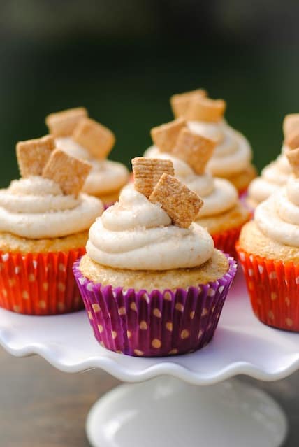 Cinnamon Toast Crunch Cupcakes - a festive cupcake that tastes just like the kid's cereal. Recipe originally published by Your Cup of Cake. | foxeslovelemons.com