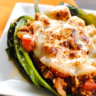 Picadillo Stuffed Chiles Rellenos - roasted poblano peppers stuffed with Cuban pork picadillo. | foxeslovelemons.com