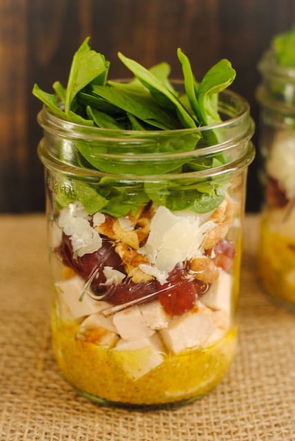 Chicken & Spinach Salad Jars - healthy and portable lunches for the work week! Lean chicken, sweet grapes, Asiago cheese, crunchy walnuts and spinach, dressed with Mustard-Thyme Vinaigrette. | foxeslovelemons.com