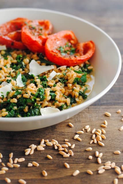 Farro and Kale Risotto with Roasted Tomatoes | www.foxeslovelemons.com