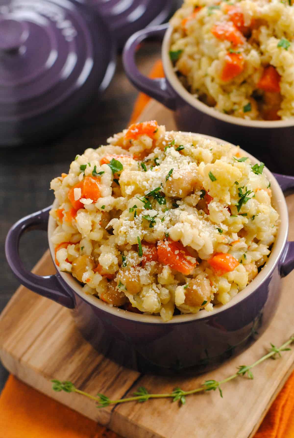 Closeup of barley risotto topped with parmesan cheese.