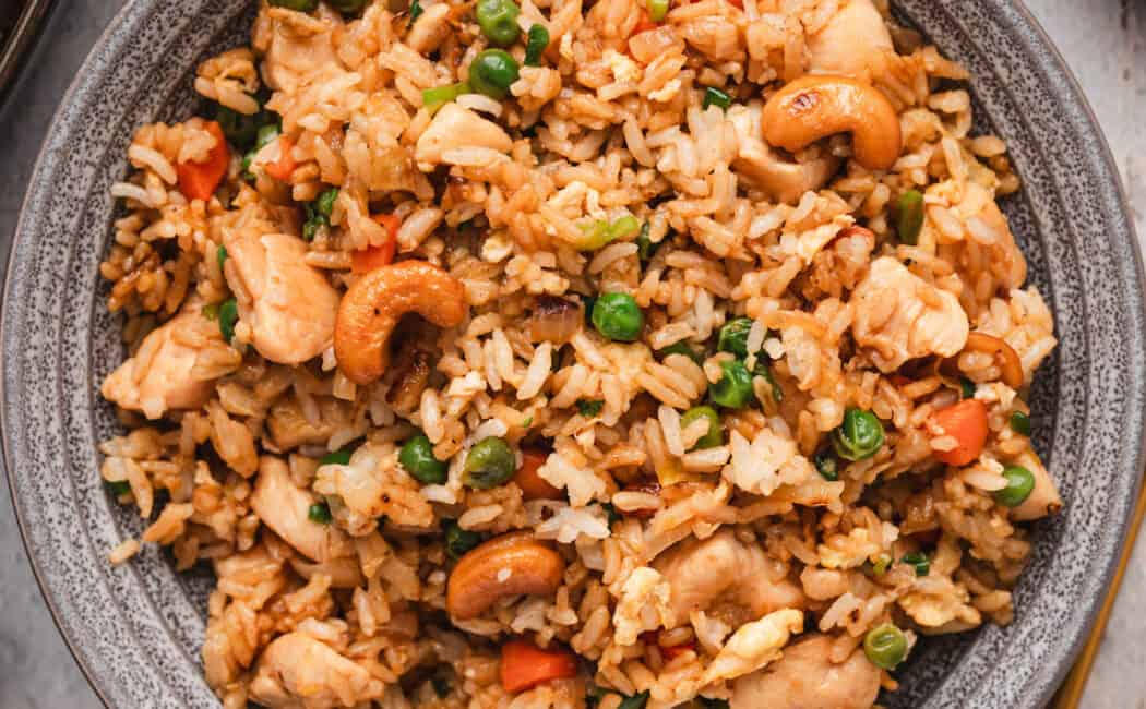 A grey bowl filled with easy chicken fried rice.