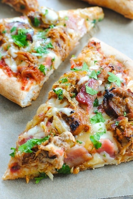 "Home Alone"-Inspired Filthy Animal Pizza - A pork-lovers pizza, topped with sausage, bacon, pulled pork, pepper jack cheese and caramelized onions. | foxeslovelemons.com