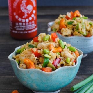 Sriracha Cashew Chicken Fried Rice - brown rice, lots of veggies and chicken make this a colorful and flavorful wok meal! | foxeslovelemons.com