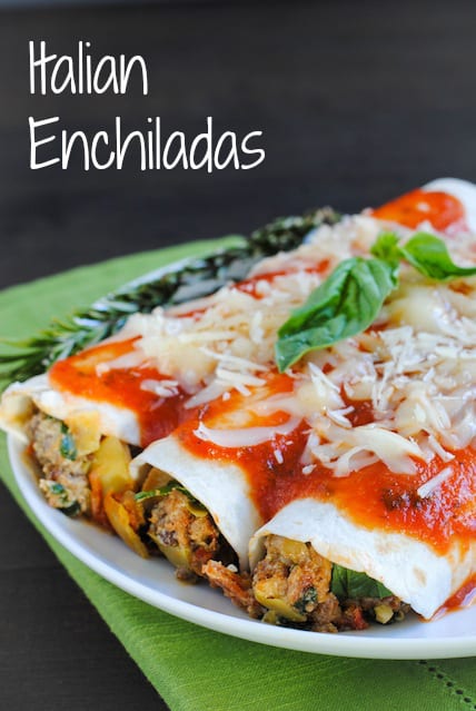 Italian Enchiladas - A tasty casserole (with hidden veggies!) the whole family will enjoy! Ground beef, Italian sausage, pepperoni, artichokes, spinach, mushrooms and ricotta cheese rolled up in flour tortillas, topped with marinara and mozzarella. | foxeslovelemons.com