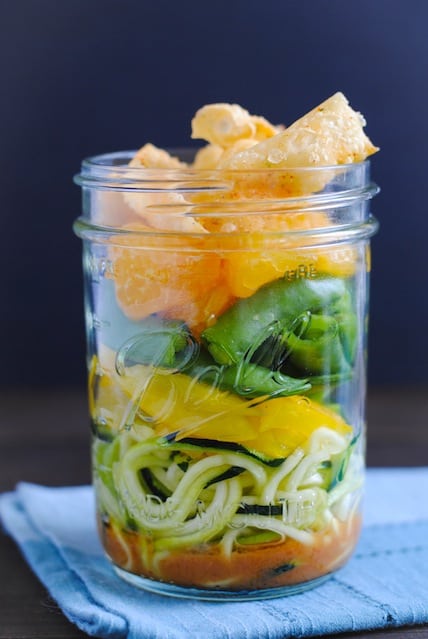 Asian Zoodle Salad Jars - Spiralized zucchini noodles, yellow bell pepper, sugar snap peas, mandarin oranges, crunchy wonton strips and sesame-ginger dressing. A portable and healthful make-ahead lunch! | foxeslovelemons.com