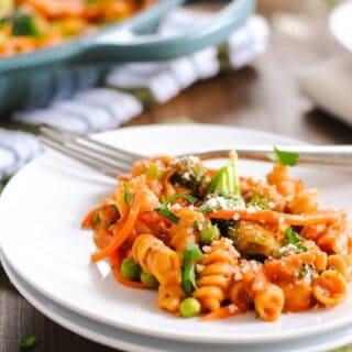 Creamy Veggie Pasta Skillet - A hearty vegetarian meal that comes together in one skillet. Creamy pasta loaded with carrots, broccoli and peas. | foxeslovelemons.com