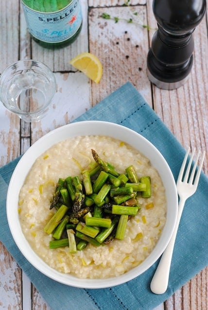 Goat Cheese Risotto with Asparagus - A restaurant-quality dish YOU can make at home. Creamy leek and goat cheese risotto topped with sautéed asparagus. | foxeslovelemons.com