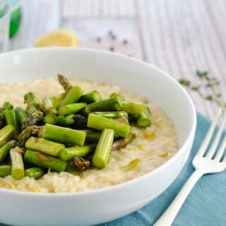 Goat Cheese Risotto with Asparagus - A restaurant-quality dish YOU can make at home. Creamy leek and goat cheese risotto topped with sautéed asparagus. | foxeslovelemons.com