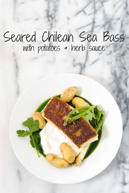 Overhead photo of seared chilean sea bass with yogurt, green sauce and potatoes. Overlay: "Seared Chilean Sea Bass with potatoes + herb sauce."