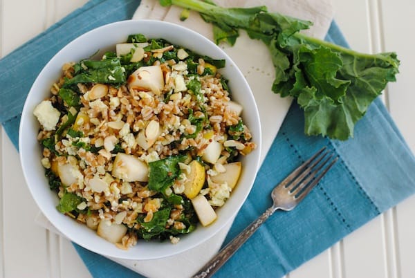 Farro & Kale Salad with Honey Mustard Dressing - Farro, pears, almonds, kale and blue cheese come together with honey mustard dressing for this hearty, healthy and crowd-pleasing salad! | foxeslovelemons.com
