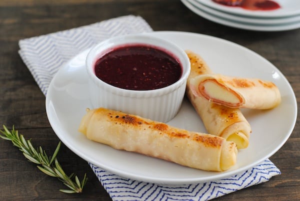 Ham & Mozzarella Sticks with Raspberry-Dijon Dipping Sauce - The appetizer version of a Monte Cristo sandwich! Gooey cheesy and ham sticks dipped in spicy-sweet sauce. Make two, or enough for a crowd! | foxeslovelemons.com