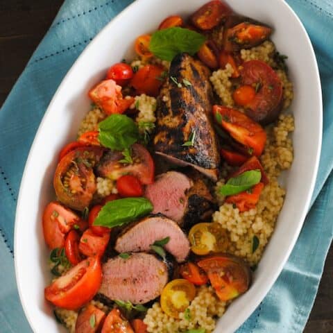 Grilled Pork Tenderloin with Couscous & Heirloom Tomato Salad - A summer meal that's as delicious as it is beautiful. | foxeslovelemons.com
