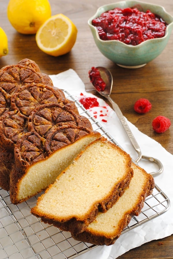 Lemon Pound Cake with Raspberry Compote - A stunning pound cake with a triple shot of lemon flavor, served with a quick raspberry sauce. | foxeslovelemons.com