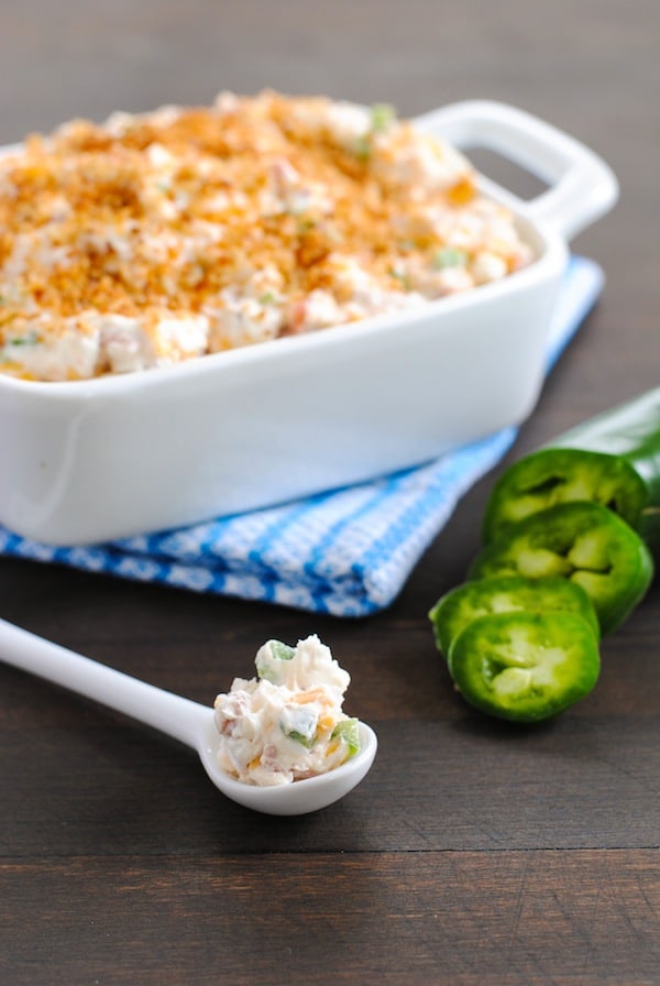 Lightened-Up Jalapeño Popper Dip - Perfect for tailgating and game-watching parties! All the flavors of a jalapeño popper, lightened-up in a dip made with Greek yogurt, turkey bacon, Cheddar cheese and a crunchy breadcrumb topping. | foxeslovelemons.com