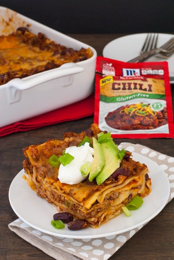 Gluten-Free Chili Lasagna - No matter your reason for skipping gluten, this casserole doesn't skip any flavor! Layers of pasta, hearty beef and bean chili, and Colby Jack cheese, topped with Greek yogurt and avocado! | foxeslovelemons.com