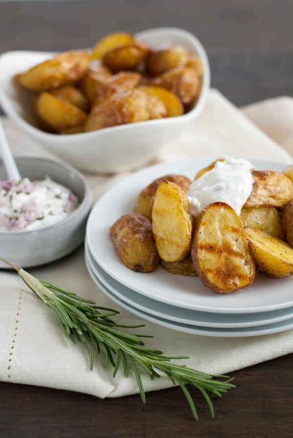 Super Crispy Roasted Potatoes with Shallot-Rosemary Yogurt - A simple technique for roasting potatoes that makes them SUPER crispy and delicious. Plus, a savory dipping sauce! | foxeslovelemons.com
