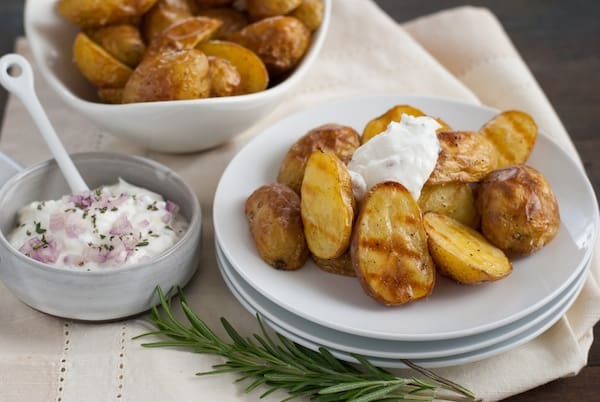 Super Crispy Roasted Potatoes with Shallot-Rosemary Yogurt - A simple technique for roasting potatoes that makes them SUPER crispy and delicious. Plus, a savory dipping sauce! | foxeslovelemons.com