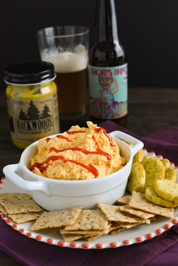 Spicy Beer Cheese Dip - A party favorite! Dip a cracker into it, or spread it on a sandwich! | foxeslovelemons.com
