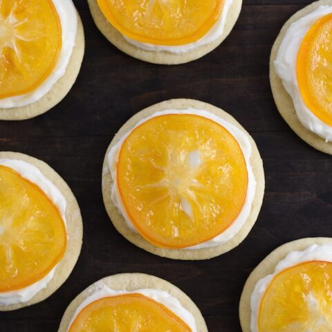 Candied Meyer Lemon Cookies - These cookies are a beautiful way to celebrate seasonal Meyer lemons! Ginger-spiced sugar cookies are topped with rich cream cheese frosting and decorated with a thin slice of candied lemon. | foxeslovelemons.com
