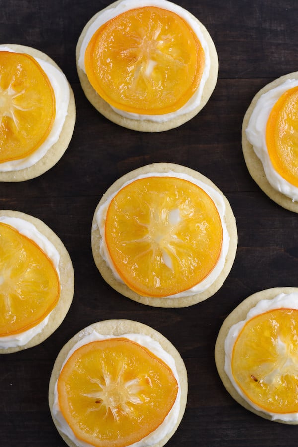 Candied Meyer Lemon Cookies - These cookies are a beautiful way to celebrate seasonal Meyer lemons! Ginger-spiced sugar cookies are topped with rich cream cheese frosting and decorated with a thin slice of candied lemon. | foxeslovelemons.com