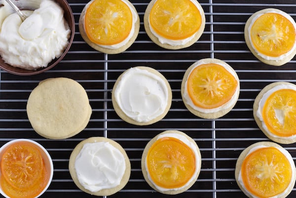 Candied Meyer Lemon Cookies - These cookies are a beautiful way to celebrate seasonal Meyer lemons! Ginger-spiced sugar cookies are topped with rich cream cheese frosting and decorated with a thin slice of candied lemon. | foxeslovelemons.com