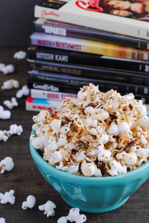 Pizza Popcorn - Start with a big bowl of popped popcorn, then whip up a quick pizza-flavored olive oil that includes sun-dried tomatoes, Parmesan cheese, and lots of Italian herbs. | foxeslovelemons.com