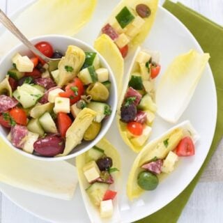 Antipasto Salad Endive Boats - Ditch the old-school relish tray and serve these no-fuss endive boats filled with your favorite meats, cheeses, olives and veggies! | foxeslovelemons.com