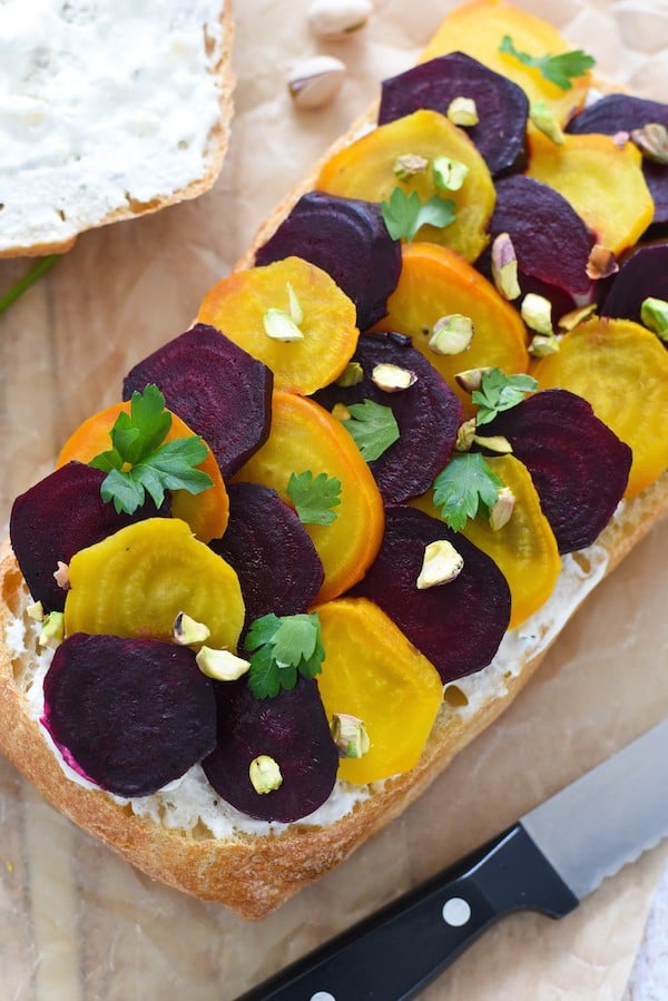 Beet, Blue Cheese & Pistachio Picnic Sandwich - Roasted beets, homemade blue cheese spread, pistachios and parsley on a big loaf of ciabatta bread. Slice and serve at a picnic or party, or eat for lunches throughout the week! | foxeslovelemons.com