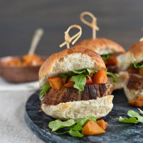 Pork Tenderloin Sliders with Spiced Apple Compote - Seared pork tenderloin topped with spiced cooked apples and peppery arugula. Serve as a party bite or a light dinner! | foxeslovelemons.com