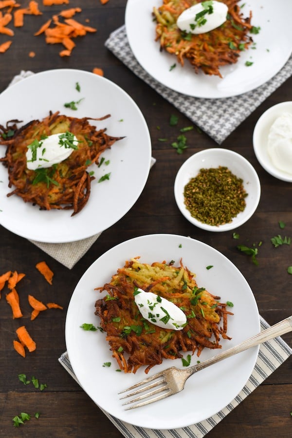 Spiced Potato & Carrot Latkes - Crispy and crunchy on the outside and light and fluffy on the inside, with tons of flavor in each bite. | foxeslovelemons.com