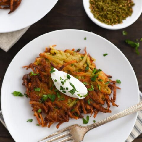 Spiced Potato & Carrot Latkes - Crispy and crunchy on the outside and light and fluffy on the inside, with tons of flavor in each bite. | foxeslovelemons.com