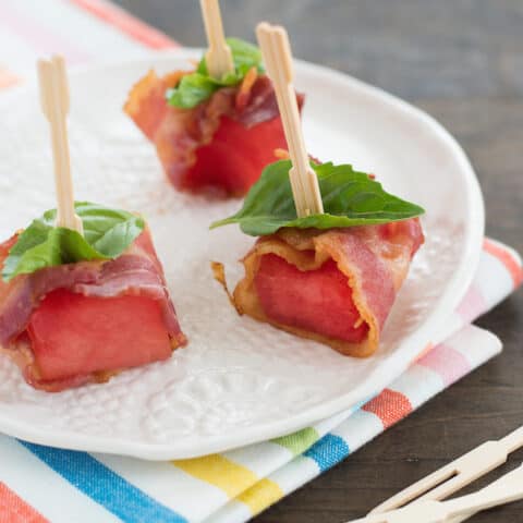 Bacon-Wrapped Watermelon Bites - A simple three-ingredient summer party bite that pairs perfectly with cocktails! | foxeslovelemons.com