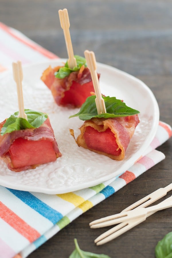 Bacon-Wrapped Watermelon Bites - A simple three-ingredient summer party bite that pairs perfectly with cocktails! | foxeslovelemons.com