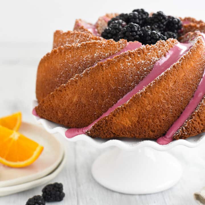 Orange Bundt Cake with Blackberry Icing - Rich vanilla cake flavored with orange zest, topped with a fresh blackberry icing. | foxeslovelemons.com