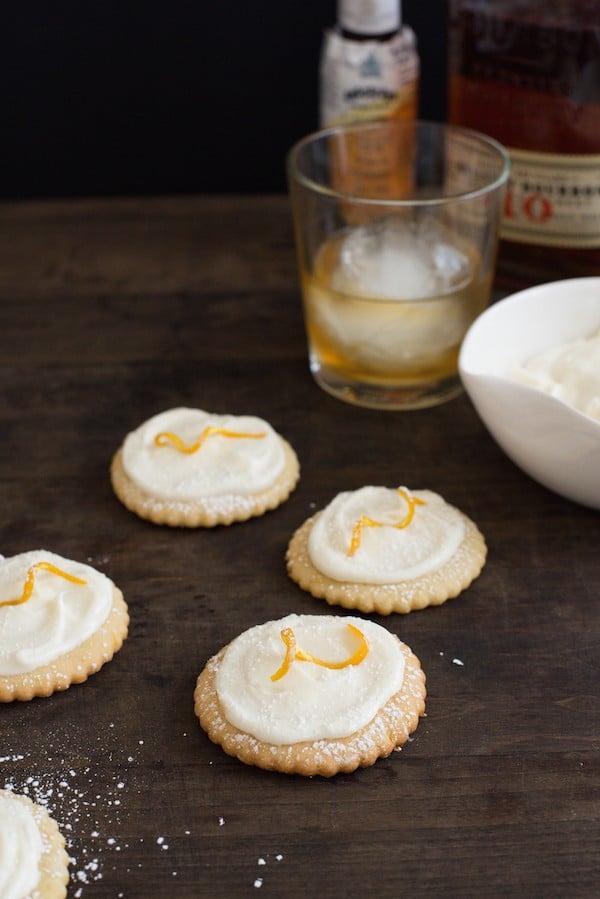 Bourbon Old Fashioned Cocktail Cookies - All the flavors of an Old Fashioned cocktail in a cookie. Sugar cookies flavored with orange zest, topped with bourbon cream cheese frosting! | foxeslovelemons.com