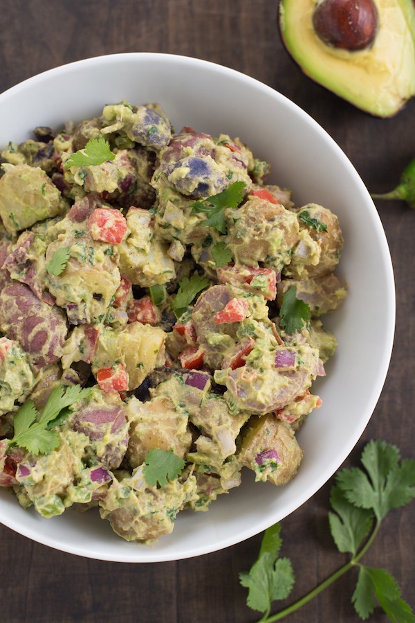 Guacamole Potato Salad - Shake up your potato salad routine! All the flavors of classic guacamole are tossed with fingerling potatoes for a unique side dish. Serve with grilled tacos or burgers! | foxeslovelemons.com