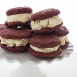 Red Velvet Cookie Ice Cream Sandwiches - Chewy cocoa and chocolate chip cookies sandwiched with cream cheese-vanilla bean ice cream! | foxeslovelemons.com