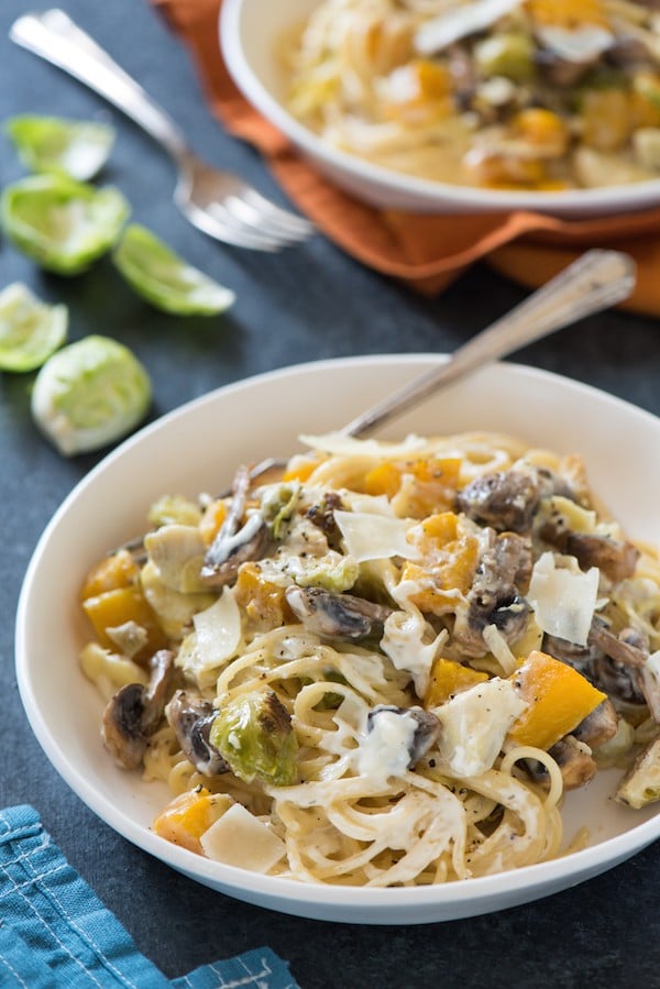 Creamy Roasted Autumn Vegetable Pasta - Celebrate fall's bounty with this creamy pasta tossed with roasted butternut squash, brussels sprouts and mushrooms. | foxeslovelemons.com