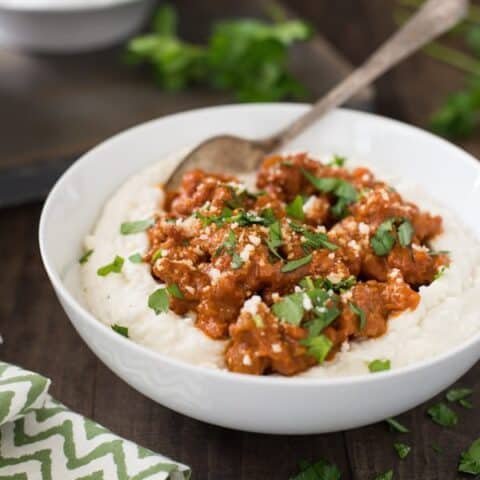 Parmesan Mashed Potatoes with Quick Sausage Ragu - The ultimate bowl of comfort! Creamy Parmesan mashed potatoes are topped with a quick ragu made with Italian sausage. | foxeslovelemons.com