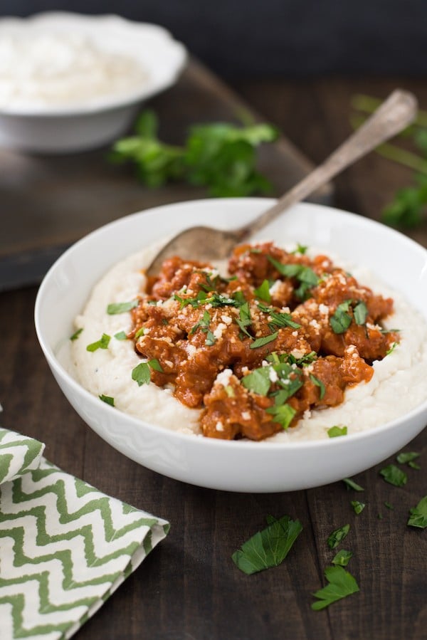 Parmesan Mashed Potatoes with Quick Sausage Ragu - The ultimate bowl of comfort! Creamy Parmesan mashed potatoes are topped with a quick ragu made with Italian sausage. | foxeslovelemons.com