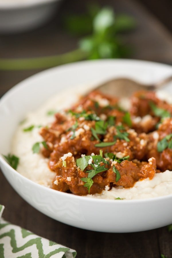 Parmesan Mashed Potatoes with Quick Sausage Ragu - The ultimate bowl of comfort! Creamy Parmesan mashed potatoes are topped with a quick ragu made with Italian sausage. | foxeslovelemons.com