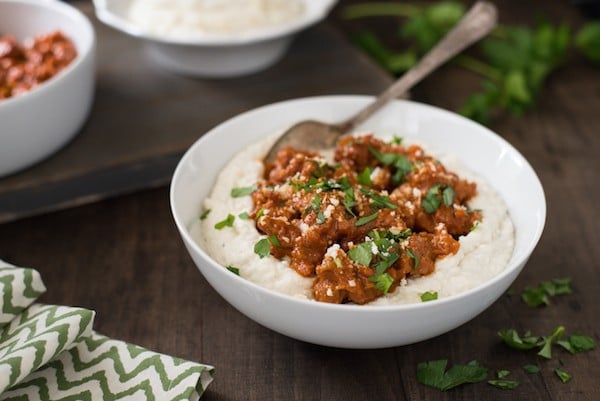 Parmesan Mashed Potatoes with Quick Sausage Ragu - The ultimate bowl of comfort! Creamy Parmesan mashed potatoes are topped with a quick ragu made with Italian sausage. | foxeslovelemons.com